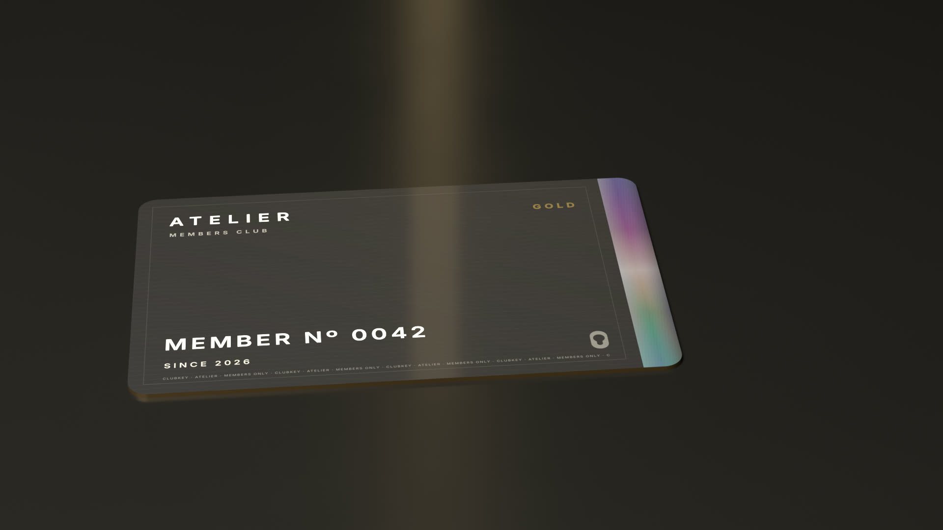 A dark minted member card resting under a single beam of light